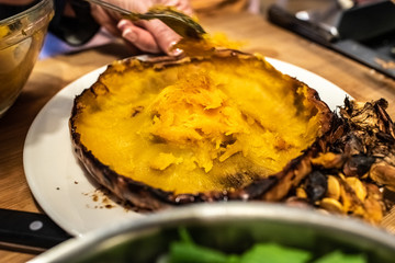 Chef slaughtering a roasted pumpkin