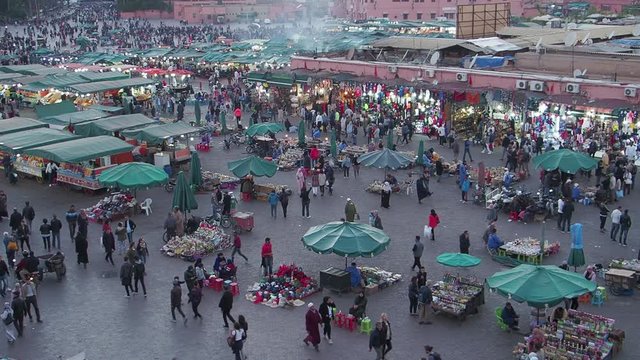 Crowds and activities in the afternoon in the main square, Jemaa el-Fnaa, in Marakesh, Morocco