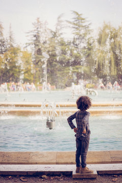 A child watching the musical fountain show in Margaret Island (Margitsziget), Budapest, Hungary.