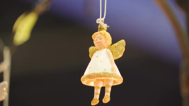 21232_An_angel_figurine_hanging_on_the_room_as_decoration.mov