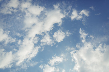 Puffy clouds up in the blue sky