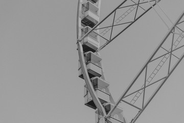 Low angle view of a ferris wheel, black and white photo