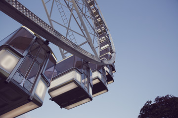 Low angle view of a ferris wheel with blue sky background 