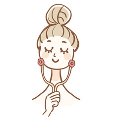 美顔ローラーを使う女性