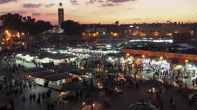 Twilight crowds and activities in the main square, Jemaa el-Fnaa, in Marakesh, Morocco