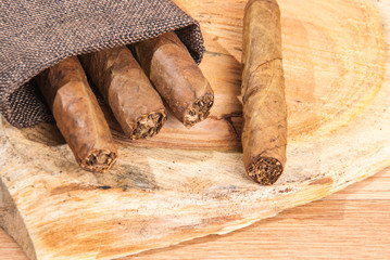 cigar of tobacco on the wooden background