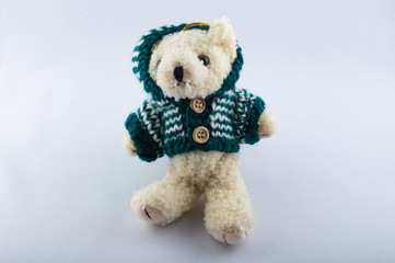 Teddy with green knitted sweater
