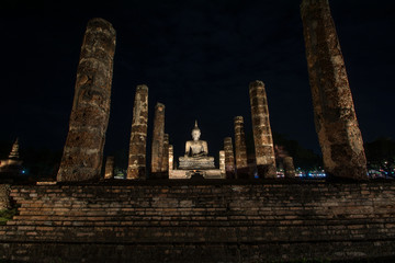 Ancient ruined Wat Mahathat in Sukhothai Historical Park at night, Sukhothai province, Thailand