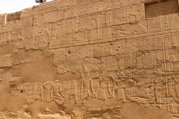 Egyptian hieroglyphs and drawings on the walls and columns. Egyp