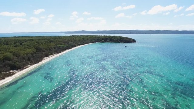 an aerial view of the beach and waters of peel island looking towards north stradbroke island in morton bay, australia