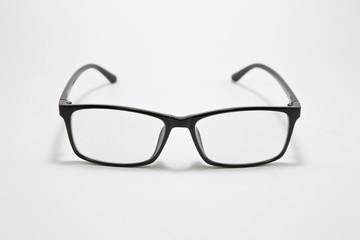 Black eyeglasses on a white background