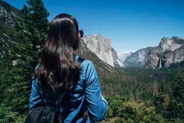 woman hiker looking at view hiking in mountain