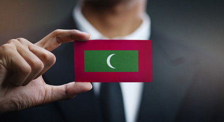 Businessman Holding Card of Maldives Flag