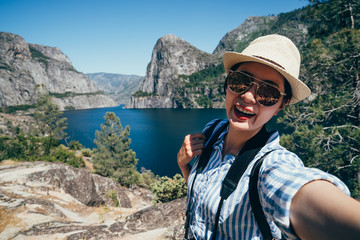 asian taking selfie with o shaughnessy dam