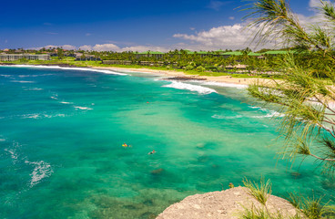 View beach and tropical sea from a cliff along the Mahaulepu Heritage Beach Trail in Kauai, Hawaii, USA
