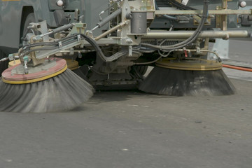 Brushes of the cleaner machine. Cleaning on the road. Clean road
