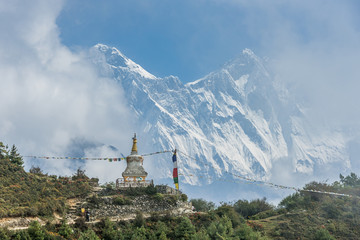 View of Mount Everest and Nuptse with buddhist prayer flags from kala patthar in Sagarmatha National Park in the Nepal Himalaya