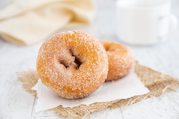 Breakfast donuts with coffee and napkin on white background - Powered by Adobe