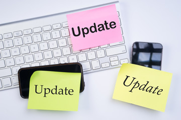 Electronic devices update concept. Update text on device on white background.
