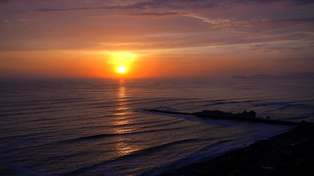 Golden seascape sunset over the Miraflores Latin American coastal beach Region of Lima Peru South America 