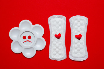 menstruation concept. a menstrual pad on red background