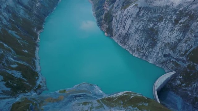 Aerial reveal, Linth&sbquo;&Auml;&igrave;Limmern Power Station and turquoise glacial waters, The Alps, Switzerland.
