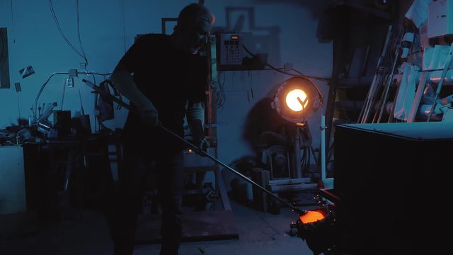 glassblower working in the workshop
