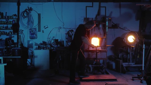 glassblower working in the workshop