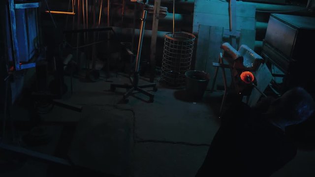 glassblower working in the workshop