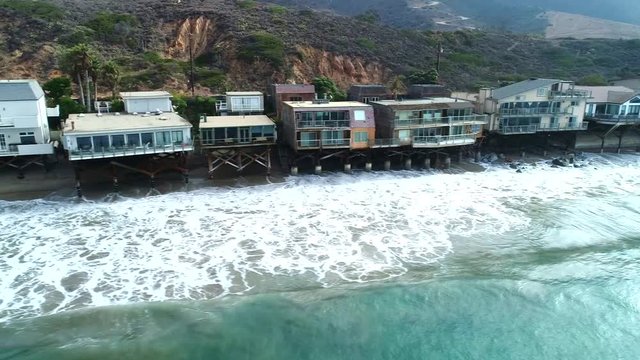Ocean with rocks and homes