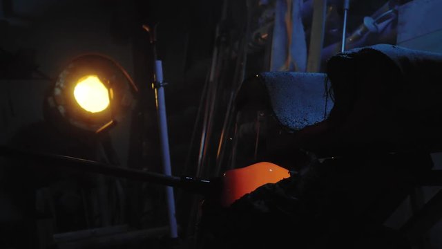 glassblower working in the workshop