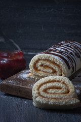 Biscuit roll with jam on old  background