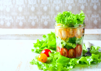 Fresh vegetable salad in a mason jar. Trends in healthy eating.