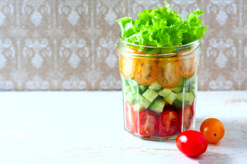 Fresh vegetable salad in a mason jar. Trends in healthy eating.