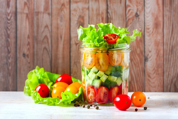 Fresh vegetable salad in a mason jar. Trends in healthy eating.