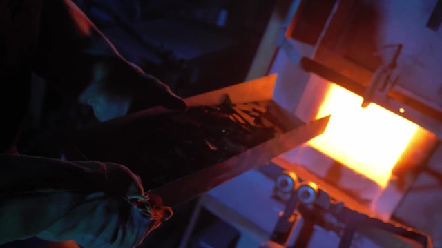 glassblower working in the workshop