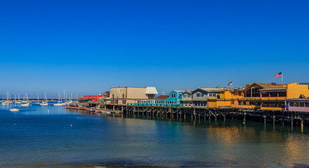 Old Fisherman's Wharf in Monterey, California, a famous tourist attraction - obrazy, fototapety, plakaty