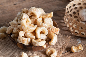 Pork rinds also known as chicharon or chicharrones , kab moo