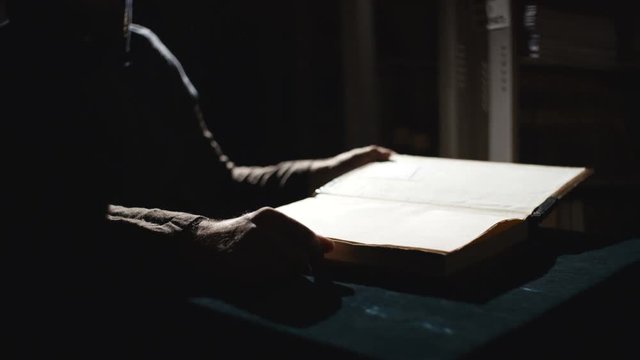 Monk is reading an old book