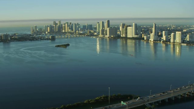 Aerial sunrise view of Julia Tuttle Causeway bridge Metropolitan Downtown Miami Skyline Biscayne Bay Florida USA 