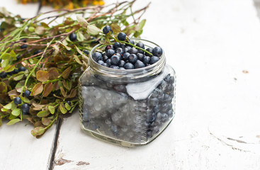 Fototapeta na wymiar Fresh blueberries in a bowl, on a wooden table.