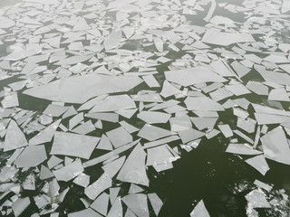 crushed thin ice on a winter river.