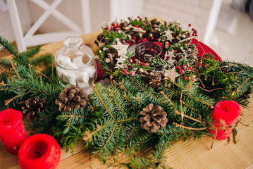 Christmas wreath. Christmas decor on the holiday table. 