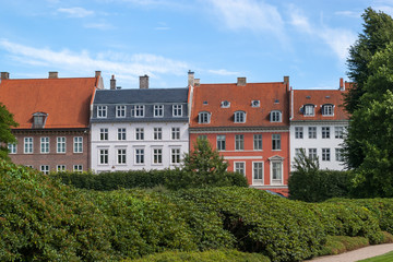 Fototapeta premium Colorful Neoclassical houses on the Crown Princess Street, seen from the Garden of Rosenborg Castle, Copenhagen, Denmark. Photo taken July 2017.