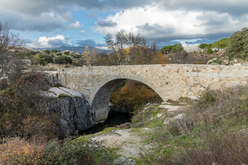 Fototapeta na wymiar Medieval bridge of the Batan in Colmenar Viejo, Madrid