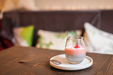 Chia pudding in glass with fresh berry. Superfoods healthy breakfast concept
