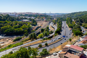 Panoramic view on Lisbon. Travel Portugal. Roads and bridges in big european city.