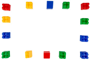 Colorful plastic bricks toy for kids isolated on white background with copy space for text.