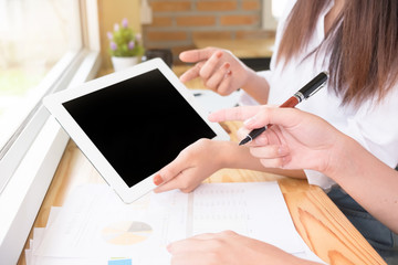 Finance team working with computer tablet, financial data in paper document audit plan to work.