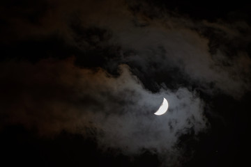 Fototapeta na wymiar Crescent in the dark cloudy sky